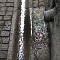 1024px-Street_gutter_in_Old_Town_Stockholm