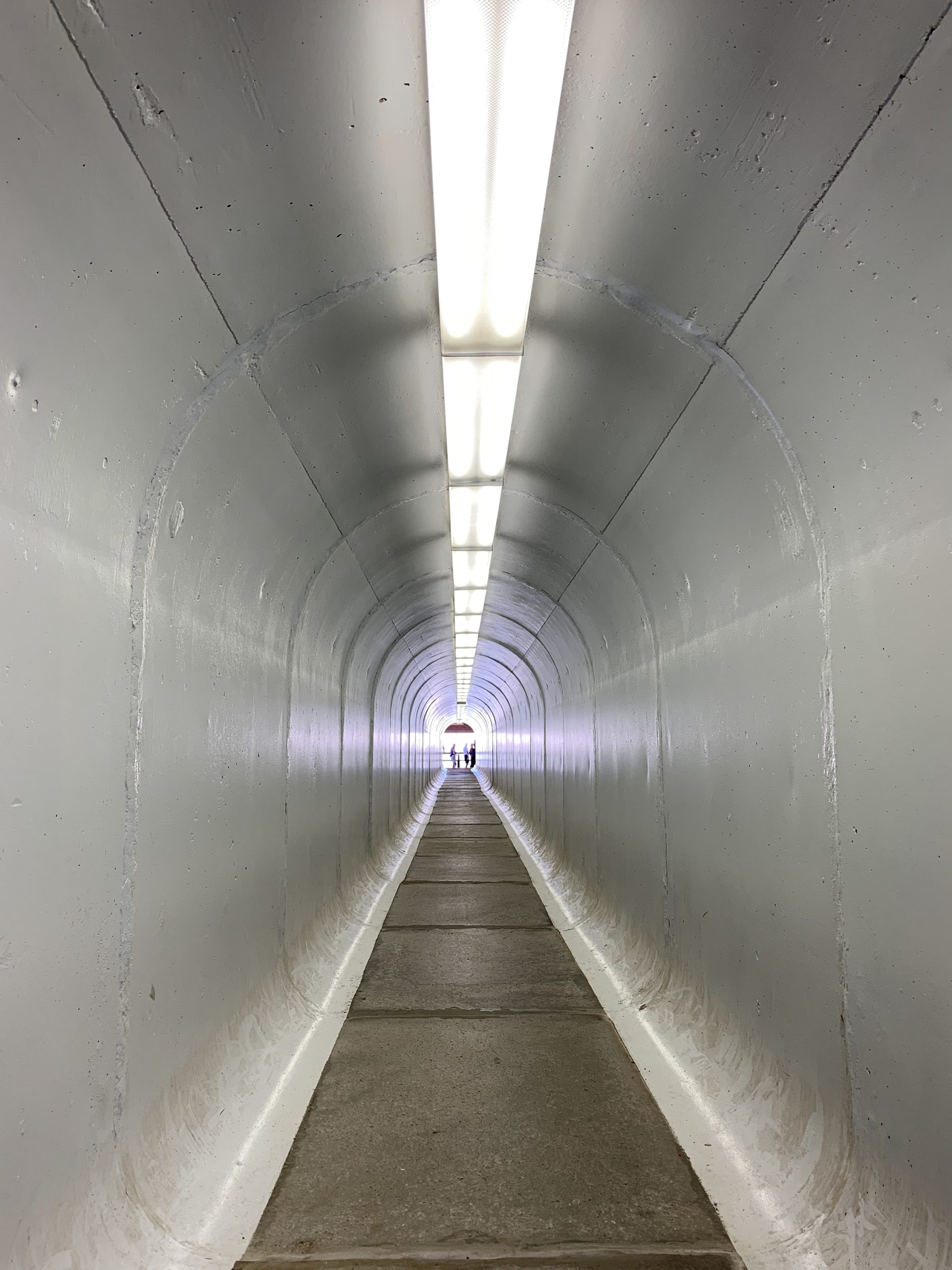 A picture of the inside of a concrete tunnel