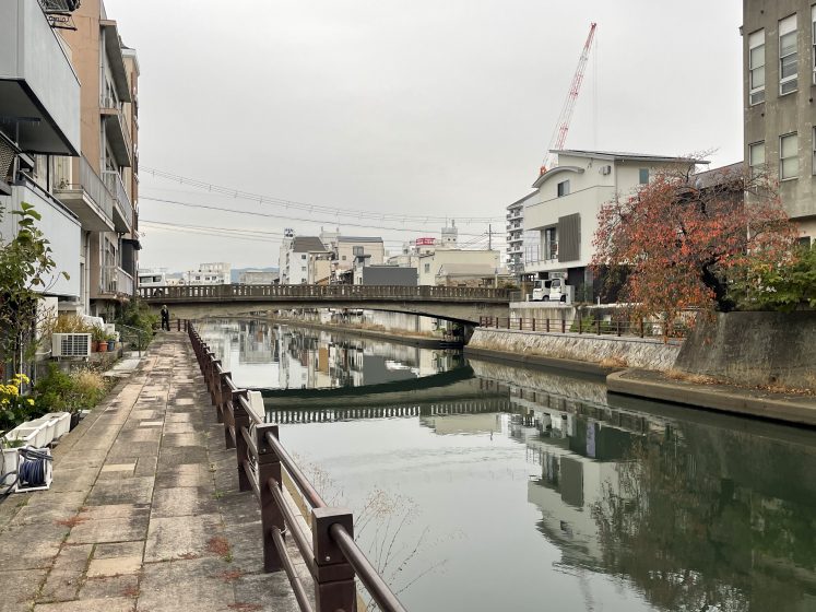A canal with buildings and a bridge