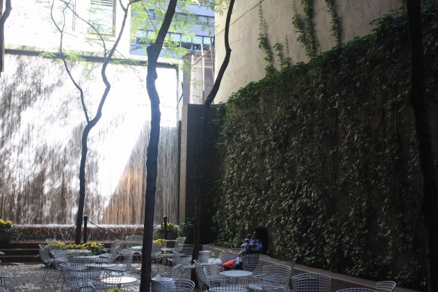 A small park in Midtown Manhattan (53rd St), with a waterfall and a green wall. Green walls may reduce up to 40dB of outdoor noise and vibration. Photo: David Maddox