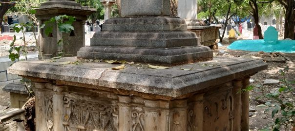 A group of old tombstones in a cemetery