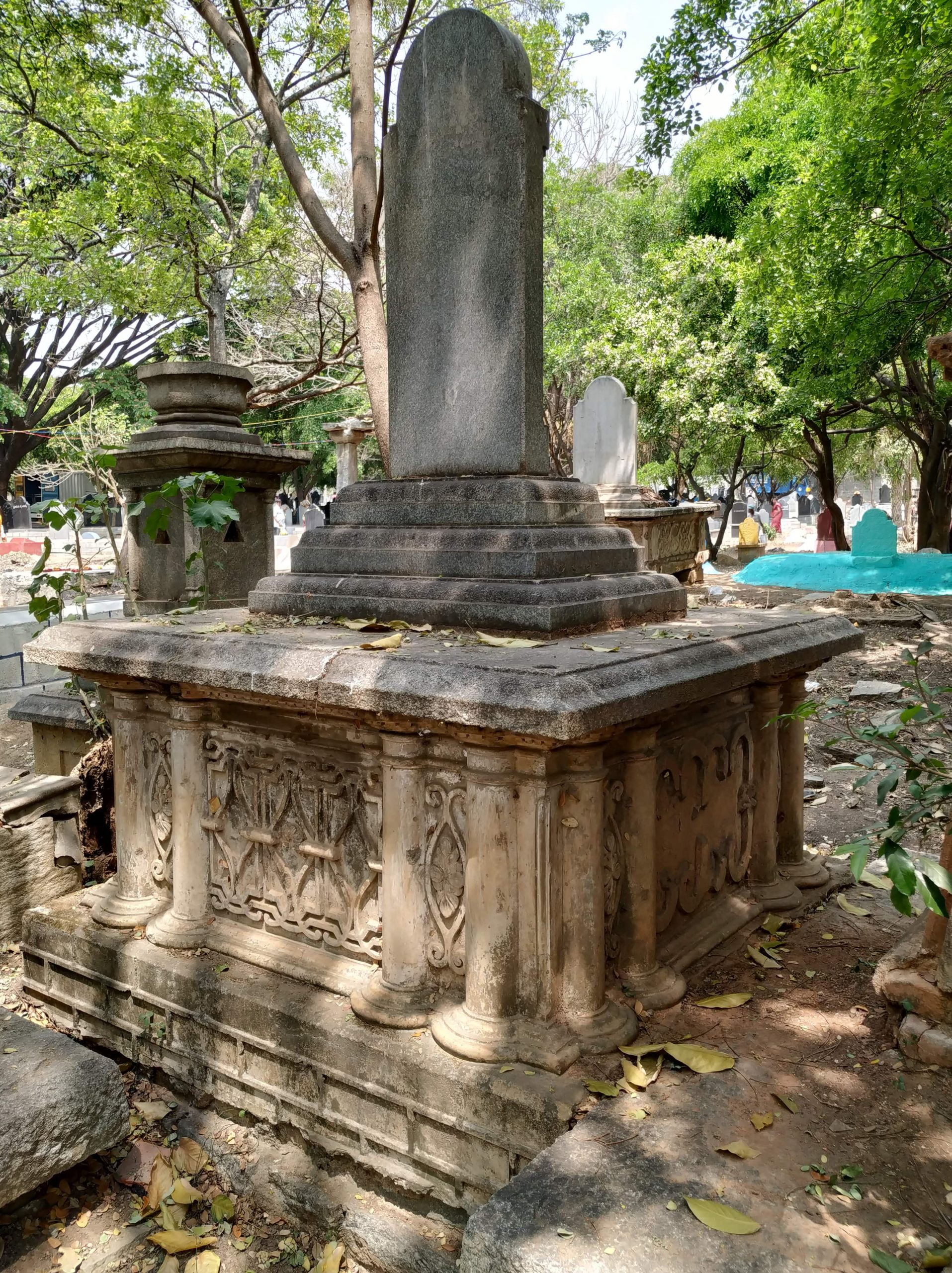 A group of old tombstones in a cemetery