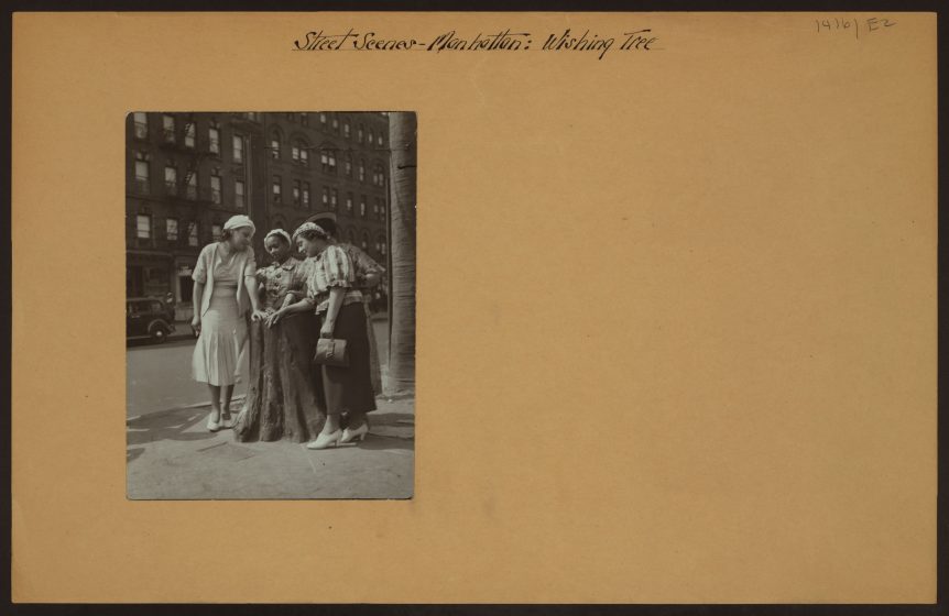 A group of women standing on a street