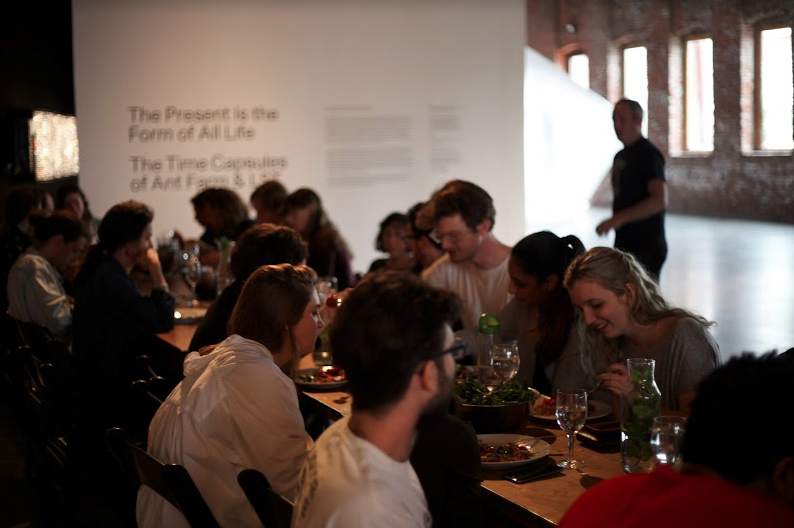 A group of people eating at a table