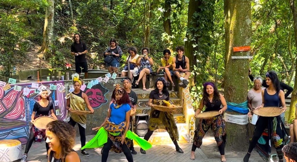 A picture of a group of performers holding baskets in an outdoor setting