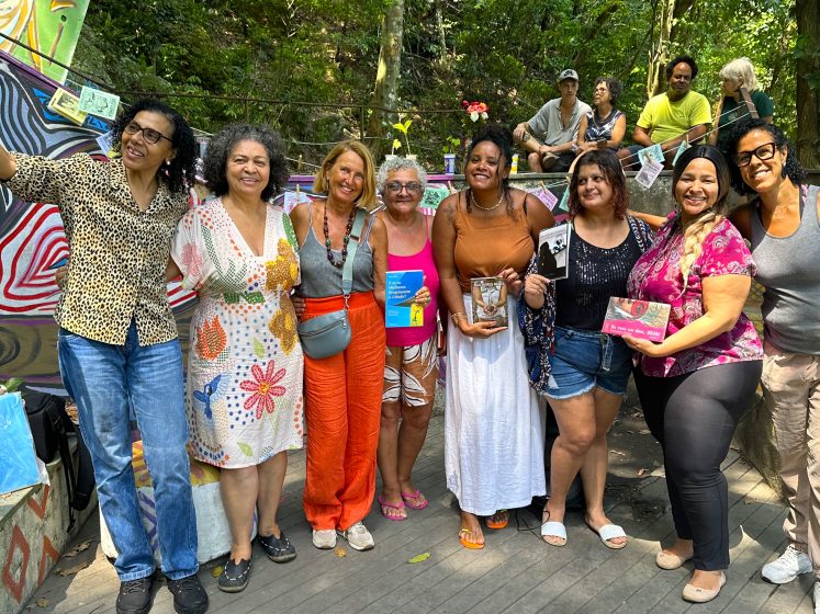 A picture of a group of women holding books